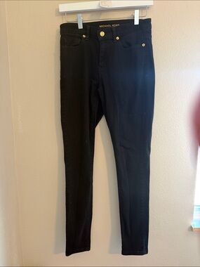 23. Michael Kors Black Skinny Jeans with Gold Hardware